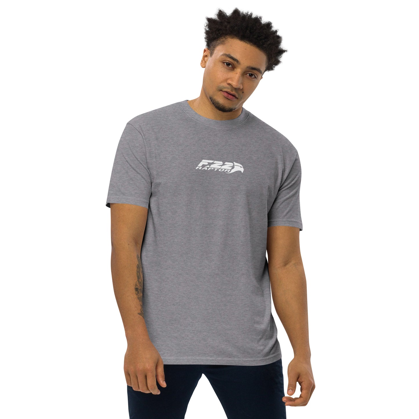 Hand-drawn technical study of the Lockheed Martin F-22 Raptor front canopy and nose section on a premium t-shirt.