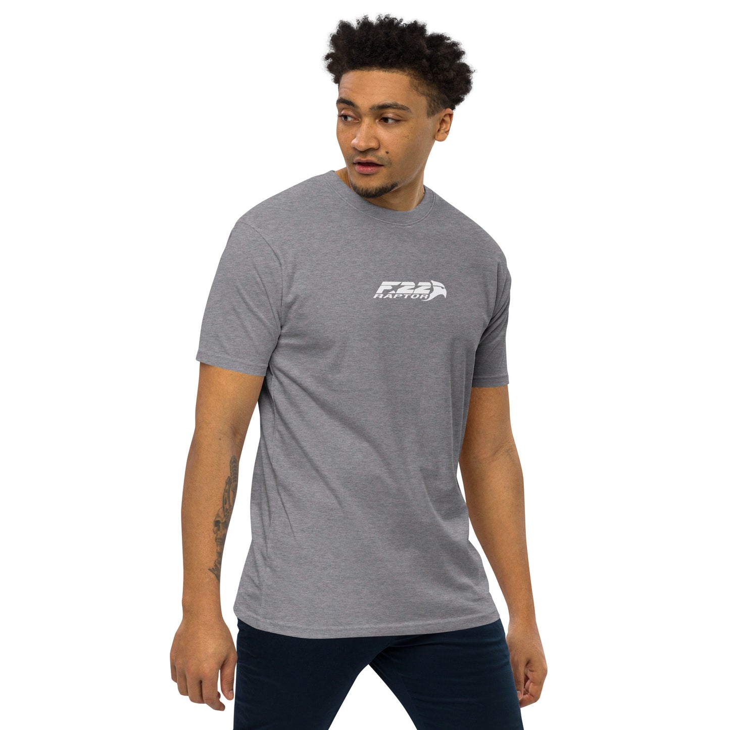 Hand-drawn technical study of the Lockheed Martin F-22 Raptor front canopy and nose section on a premium t-shirt.