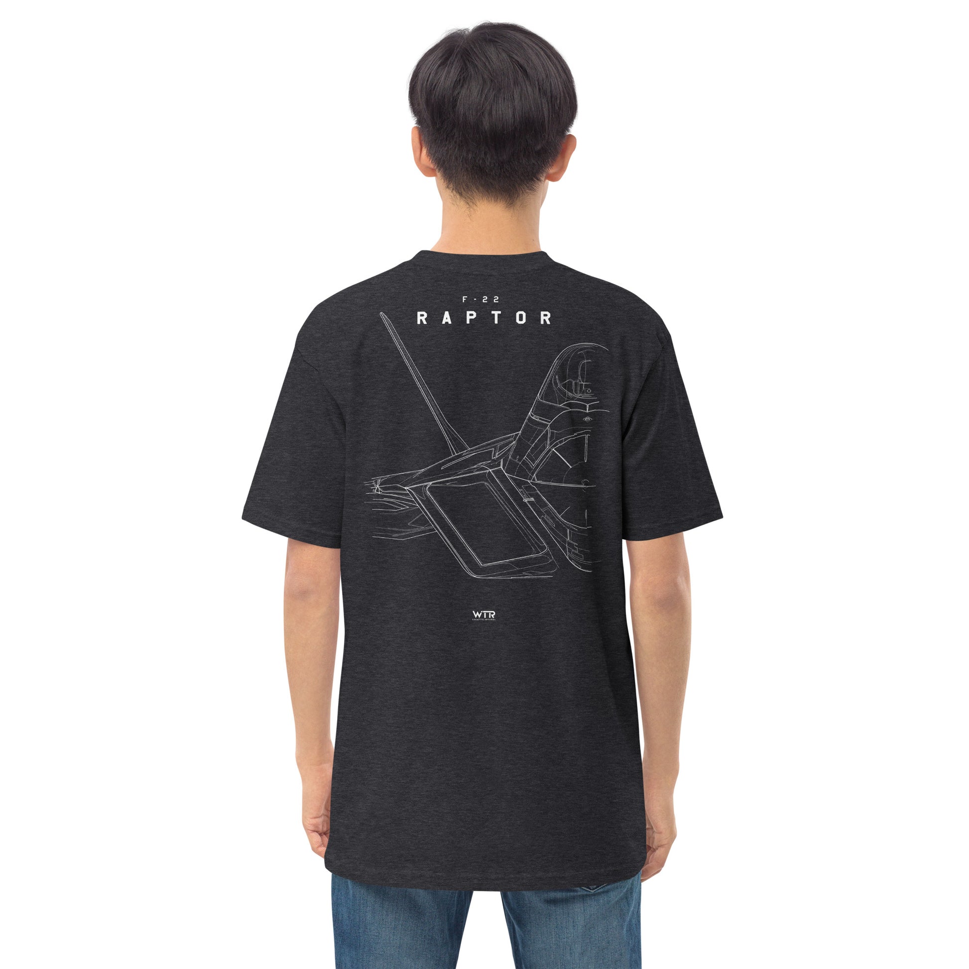 Hand-drawn technical study of the Lockheed Martin F-22 Raptor front canopy and nose section on a premium t-shirt.