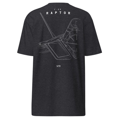 Hand-drawn technical study of the Lockheed Martin F-22 Raptor front canopy and nose section on a premium t-shirt.