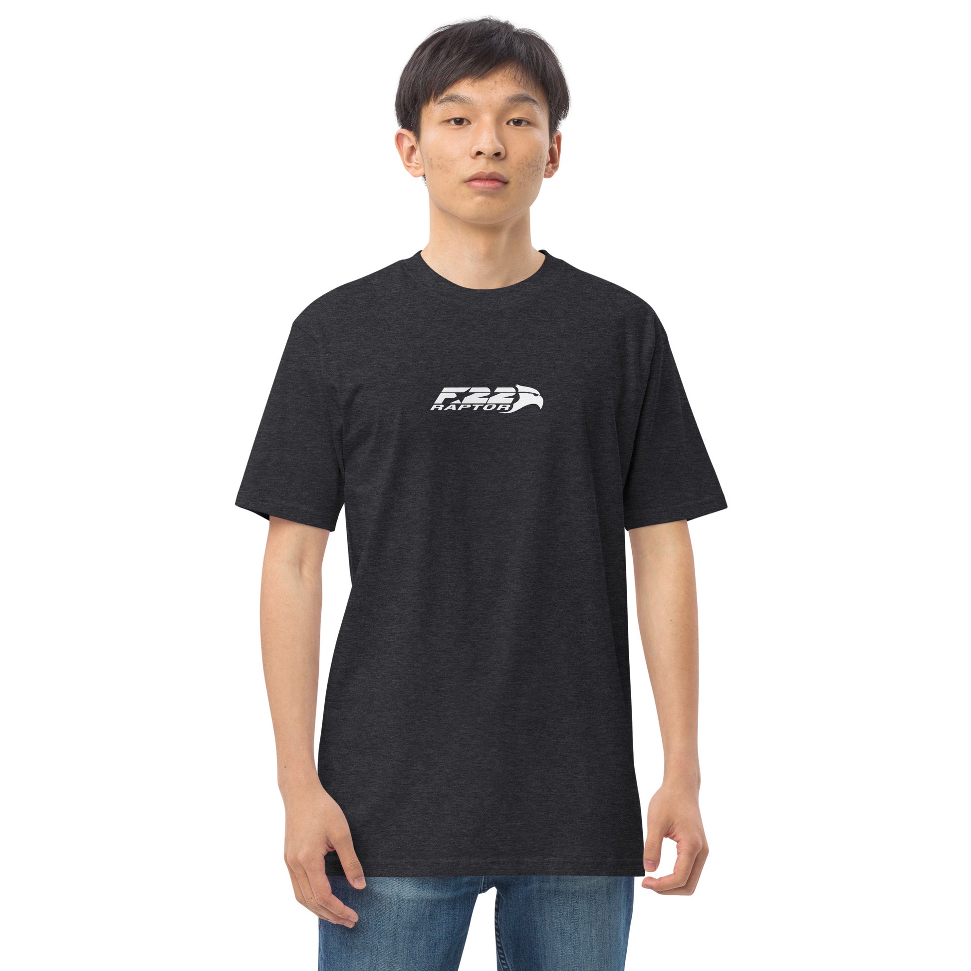 Hand-drawn technical study of the Lockheed Martin F-22 Raptor front canopy and nose section on a premium t-shirt.