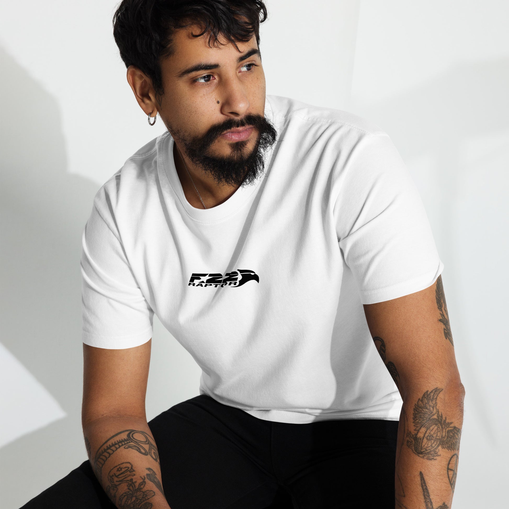 Hand-drawn technical study of the Lockheed Martin F-22 Raptor front canopy and nose section on a premium t-shirt.