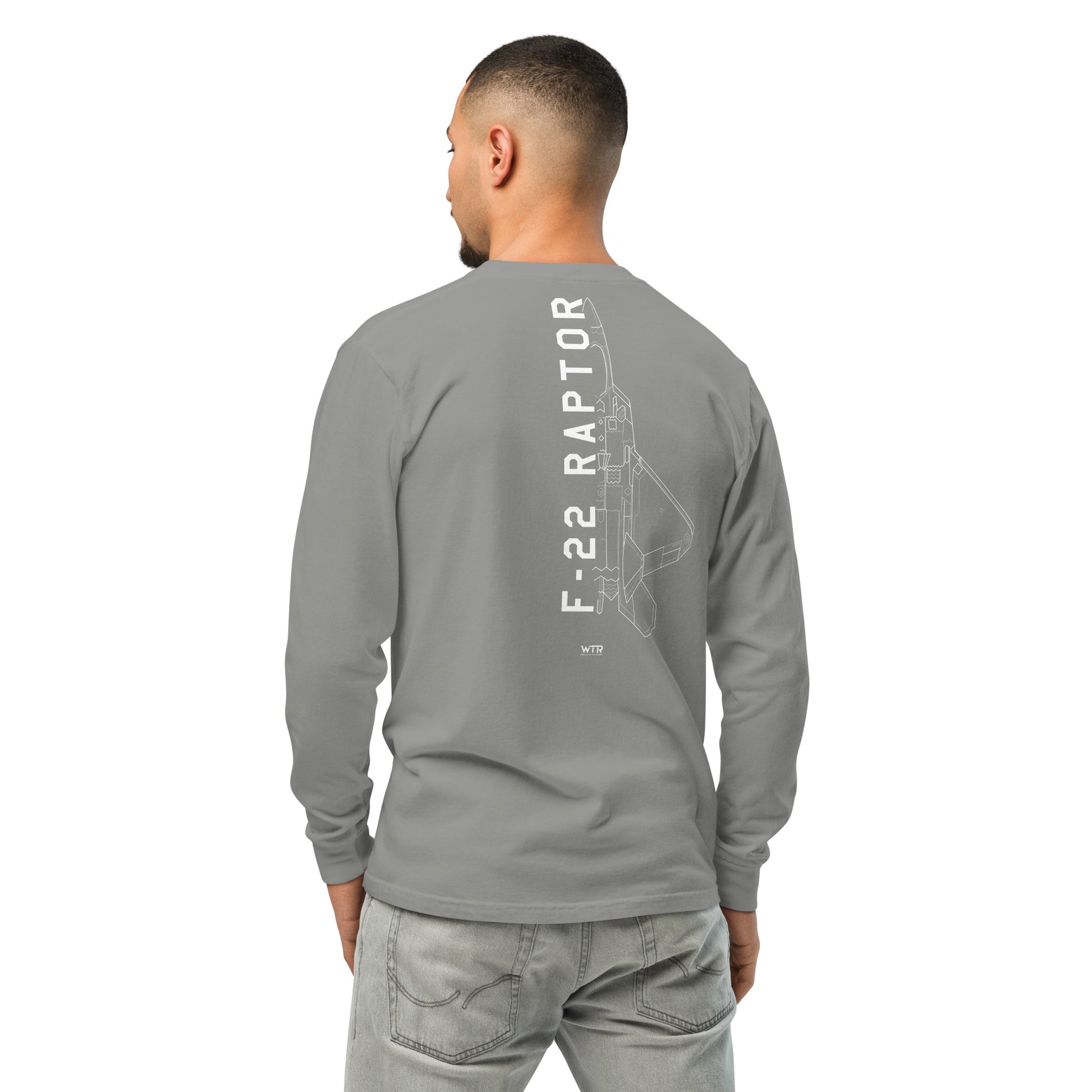 Hand-drawn technical schematic of the Lockheed Martin F-22 Raptor stealth fighter on a standard long-sleeve t-shirt.