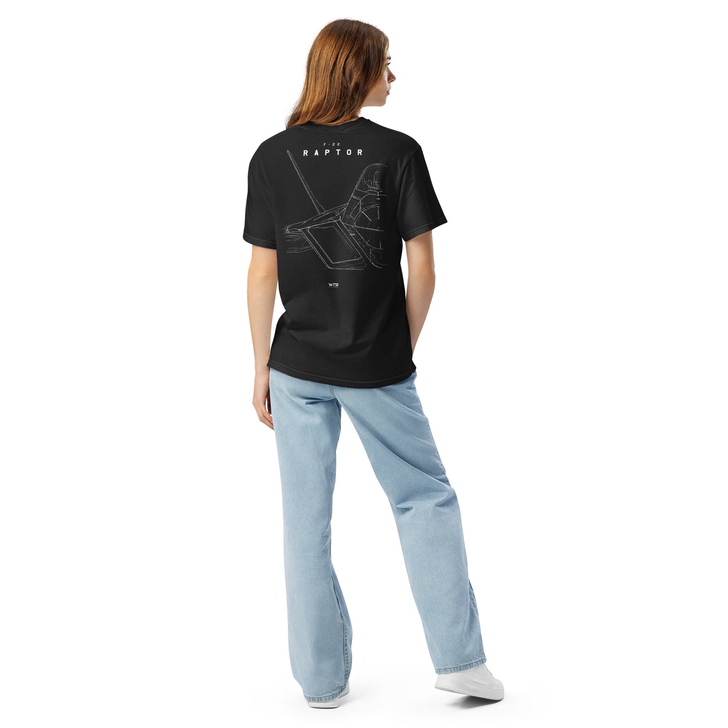 Hand-drawn technical study of the Lockheed Martin F-22 Raptor front canopy and nose section on a standard t-shirt.