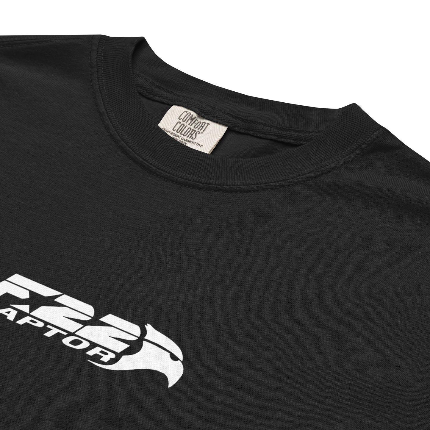 Hand-drawn technical study of the Lockheed Martin F-22 Raptor front canopy and nose section on a standard t-shirt.