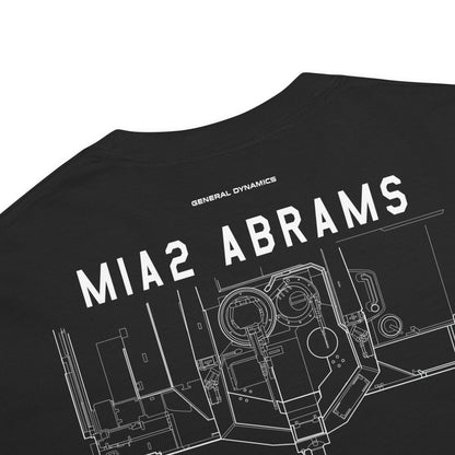 Hand-drawn schematic of the GENERAL DYNAMICS M1A2 ABRAMS TANK printed on a standard T-shirt.
