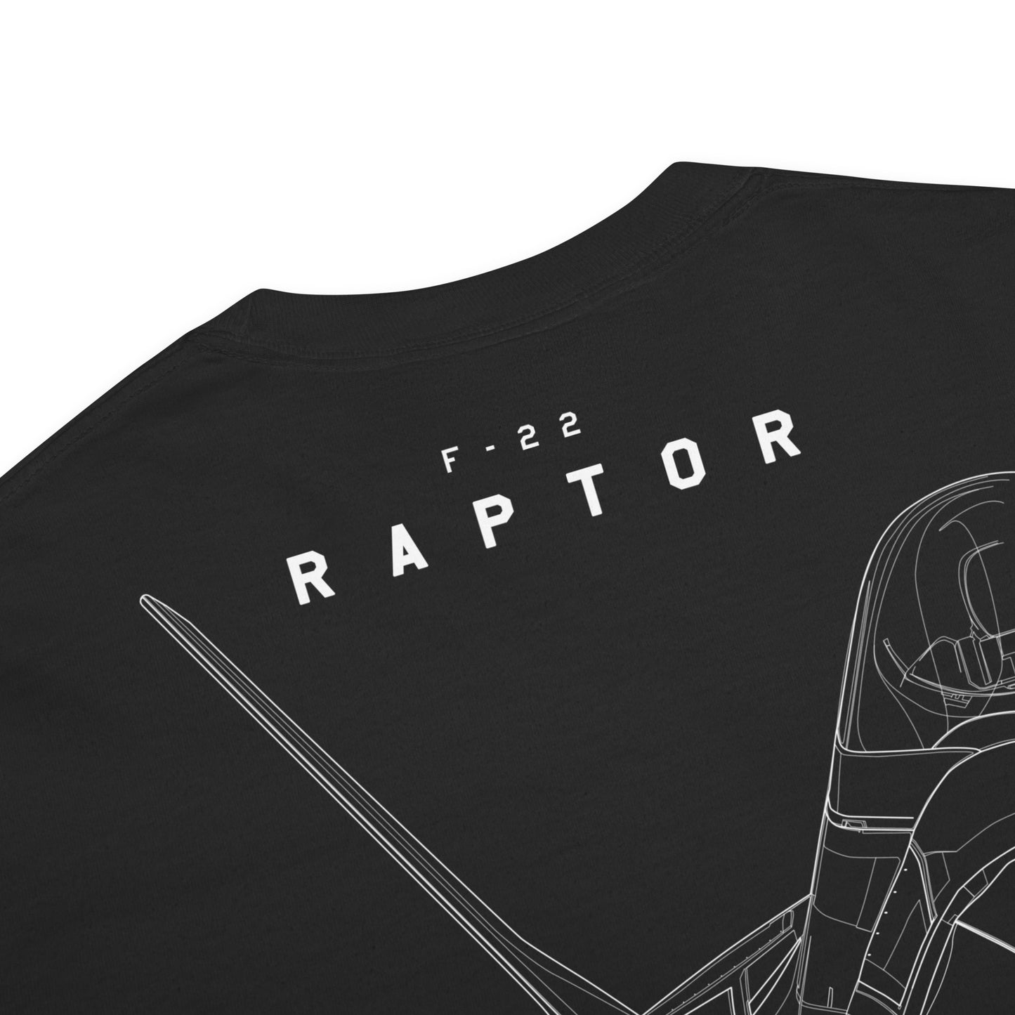 Hand-drawn technical study of the Lockheed Martin F-22 Raptor front canopy and nose section on a standard t-shirt.