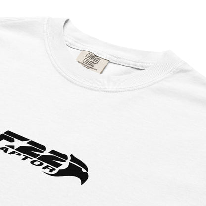 Hand-drawn technical study of the Lockheed Martin F-22 Raptor front canopy and nose section on a standard t-shirt.